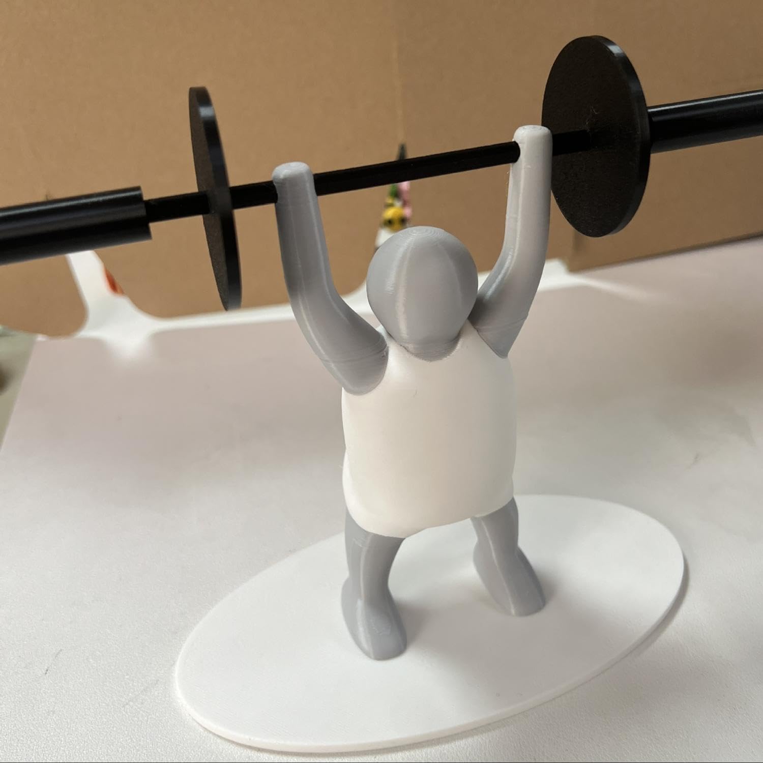 Novelty Toilet Paper Holder with Strong Man Design White and Gray